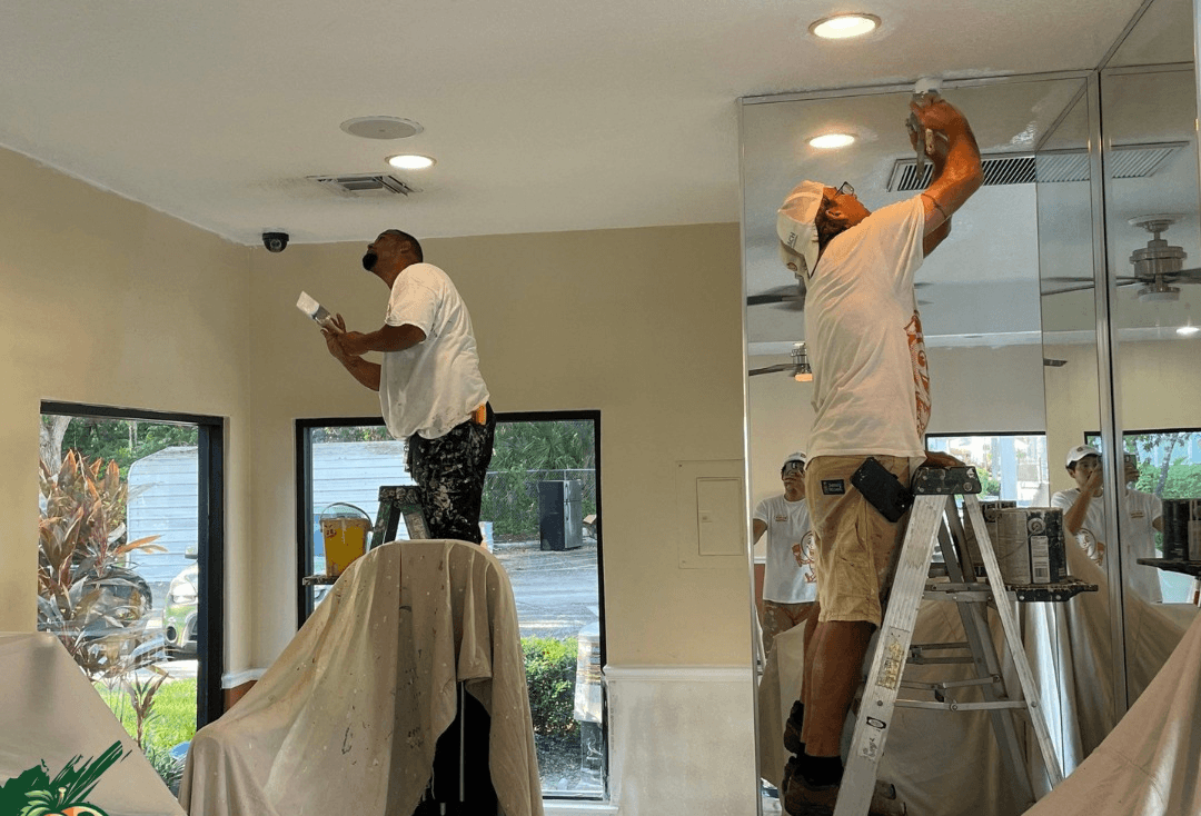Crew at work painting an interior house in tampa